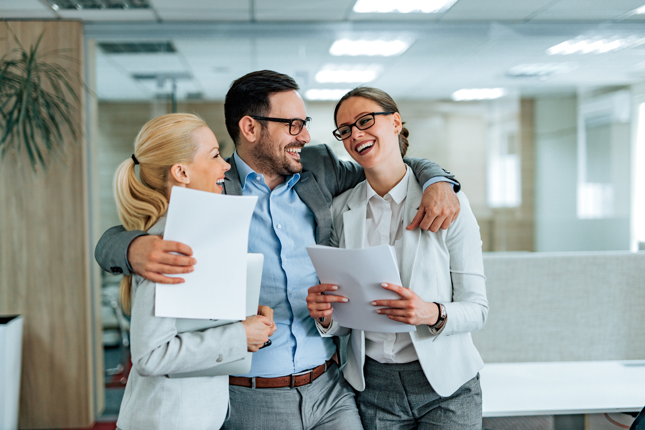 Portrait of a happy business team celebrating teamwork achievement. stock photo