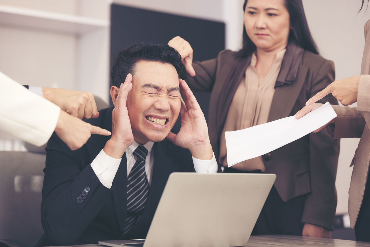 Employee An enraged executive pointing out his office boos, It is your fault if you make a business mistake and are punished 