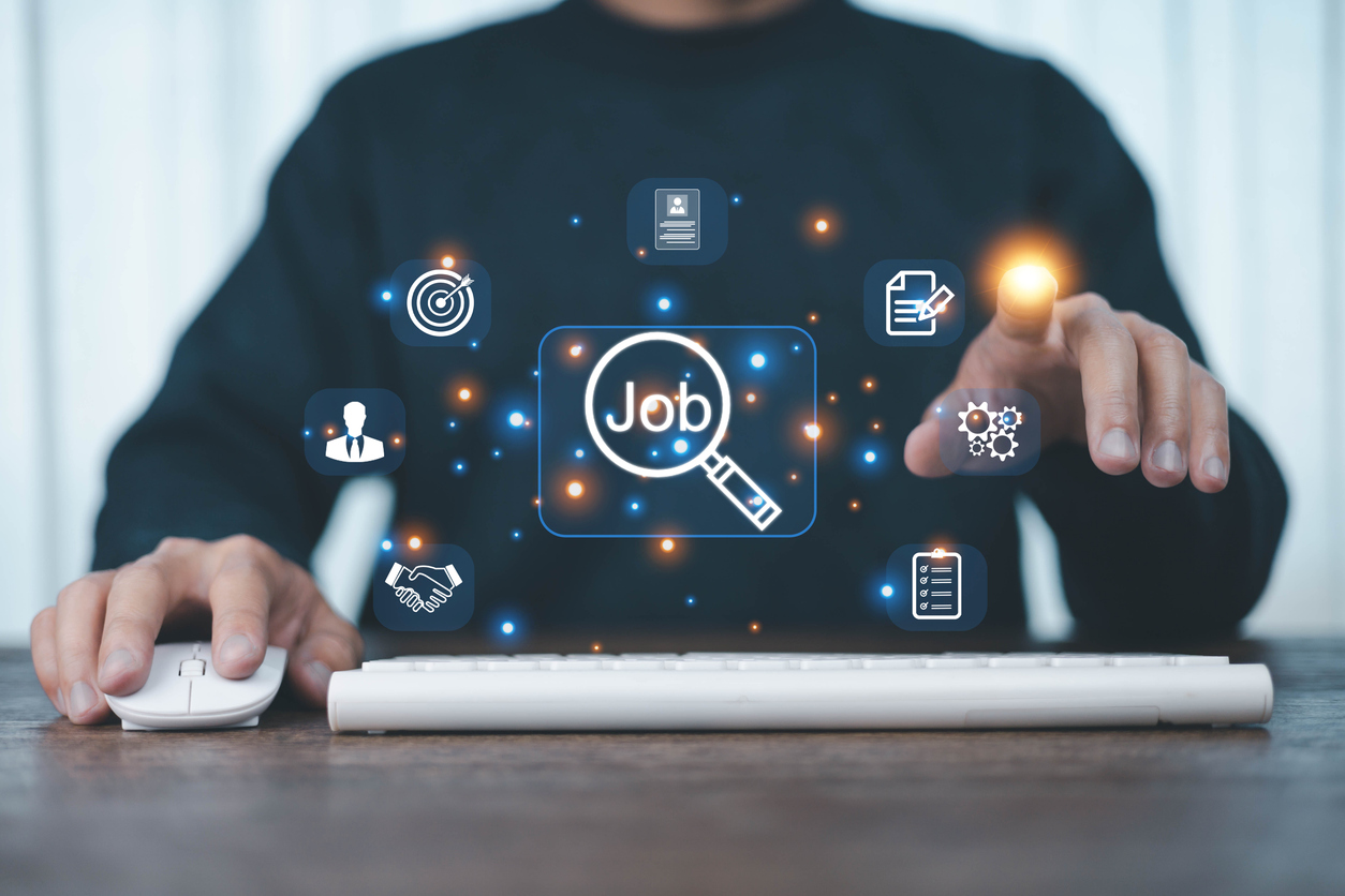 Job search concept. Man using laptop for job search and fill out personal data on job website, A man shows icon front of him,
