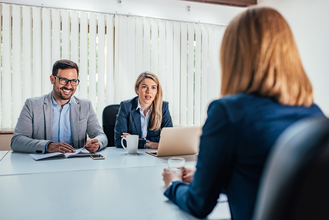 Business - young woman sitting in job interview