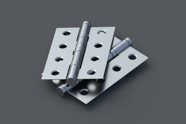 Dos bisagras de puerta sobre fondo gris. Herrajes de construcción.
